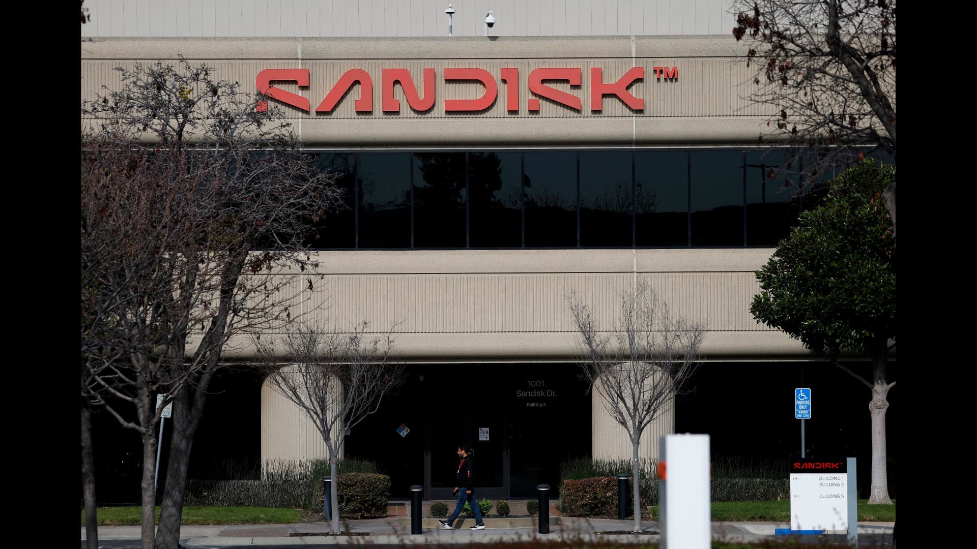 Stocks making the biggest moves midday: SNDK, MRVL, DDOG, CLF, AMZN